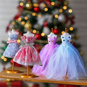 Fashion Design Studio Kit with miniature dress mannequins in colorful fabric gowns for kids' creative play.